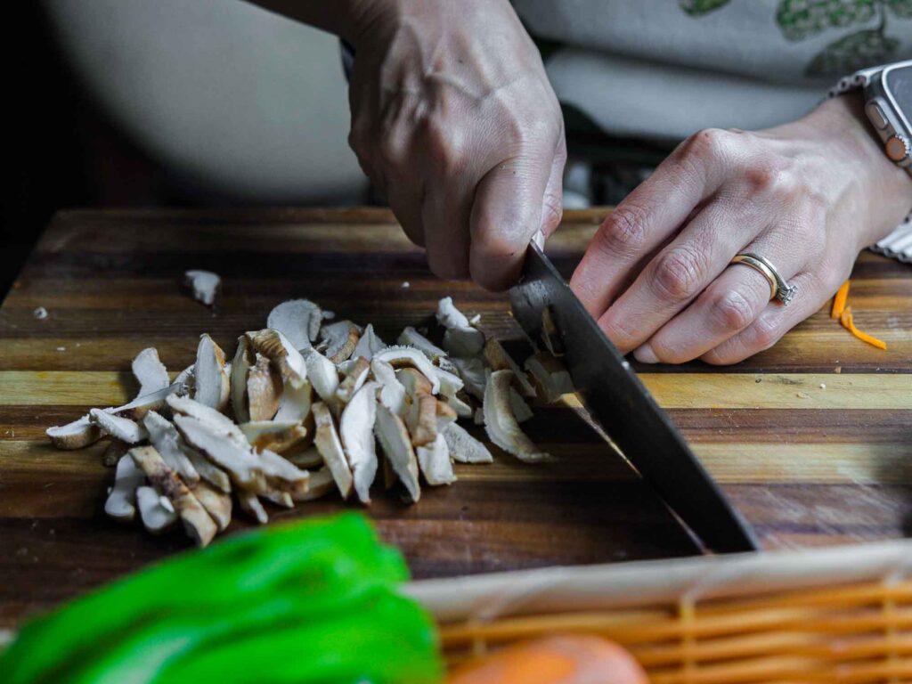 slicing shiitake mushrooms